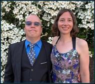 A person and person standing in front of a bush

AI-generated content may be incorrect.